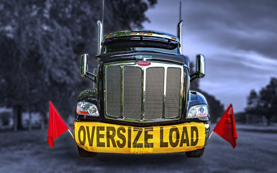 heavy oversize load being transported by small freight broker