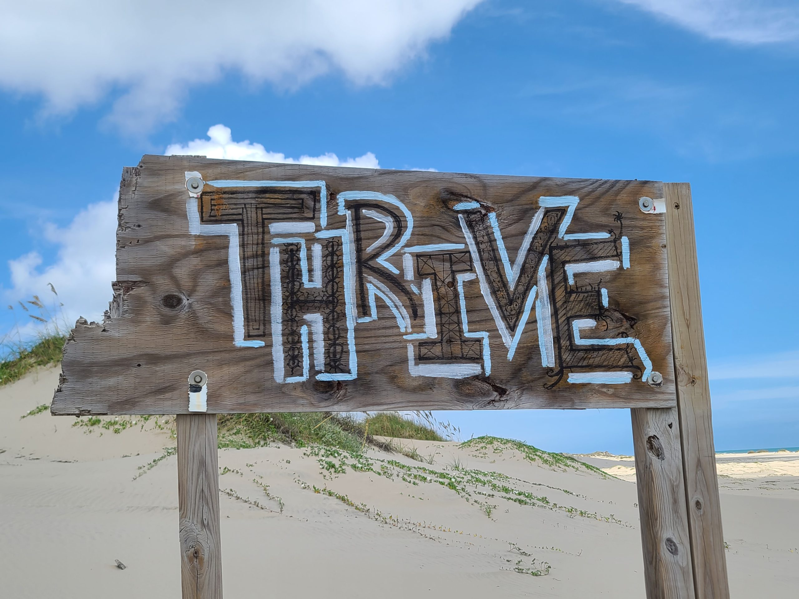 Small freight brokers thrive sign at the beach